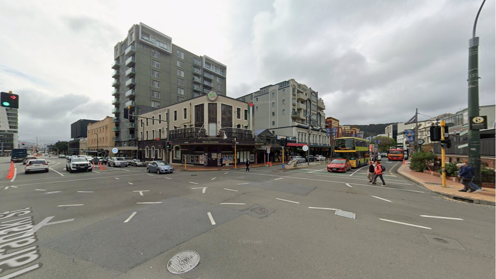 134 Courtenay Place today: a grey intersection with tired buildings